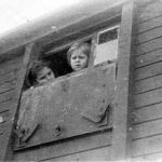 
						The above photo is of Basia Sgrunowska and Farynka Sgrunowska on the train from Lugova to Krasnowodzk (in the evacuation to Persia after their deportation to the USSR), 23 March 1942 (from the private archives of Zofia Jordanowska - courtesy of VideoFact).					