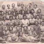 
						"Harcerki" (Polish Girl Scouts) on 5 September 1943, Ahwaz, Persia. My Aunt Aniela Jesionka, lying in front row, on left.					