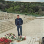 
						Stephen Sobolewski standing beside the Anders Memorial					