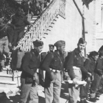 
						I believe this is of the Young Polish Soldiers Secondary School, also at Heliopolis. Dad is in the centre, with an object (furled pennant?) in his right hand.					