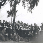 
						My Father has a young girl in his arms on the right side of the photo.					