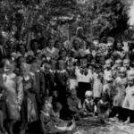 
						A gathering of children, staff, and visitors at one of the orphanages in Persia. I have no other information about this event					