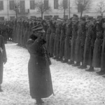 
						Mlot Fijalkowski, commander of 18 division, inspecting troops at Lomza barracks.					