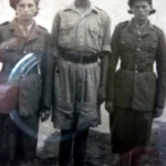 
						Hela, Piotr and Tola in their new uniforms					