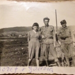 
						Left to right, Jadzia Pacewicz, Jozef Pacewicz, unknown: Most likely in the 8th Dresden Infantry Division, Polish Army (under Soviet command) possibly 1945 or just after between Jasło and Rzeszów in a German field camp for Soviet prisoners (the large fences are visible behind).					