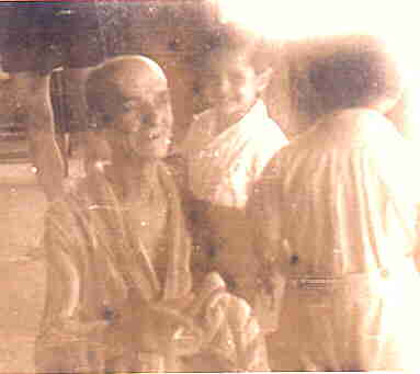 Jan Sulkowski (himself very sick) among his beloved orphans.