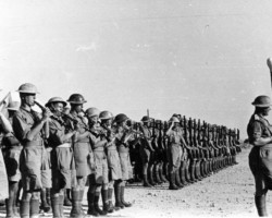 The orchestra and the honor guard of the 3rd Carpathian Rifle Division awaiting the arrival of General Sikorski, Pelcan, Middle East, 1943; source: private collection of Prof. Zbigniew Wawer The orchestra and the honor guard of the 3rd Carpathian Rifle Division awaiting the arrival of General Sikorski, Pelcan, Middle East, 1943; source: private collection of Prof. Zbigniew Wawer
