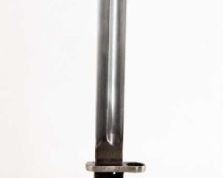 Polish bayonet wz. 1928
Manufactured by Fabryka Broni in Radom. Bayonets of this type were used by the Border Guard and the Border Protection Corps.
Construction:
A single-edged blade with a two-sided concave groin. Convex two-sided cut, single-edged symmetrical tongue. Handle with wooden covers attached to the shaft with two bolts and nuts. Handle with a fire shield overlapping the back of the head. Mounting on the rifle in the handle guide with the barrel supporting the concave milling of the handguard. Hole for the rod with drainage through the cuts at the bottom of the covers. Clasp with a spiral spring. Steel sheath with a knob at the bottom, with a clip soldered together with a strengthening oval washer to the sheath of the scabbard. Elongated catch at the top to make it easier to remove the frog. A gland with two flat springs and a spur, attached to the sheath with a single screw. It differs in characteristics from wz.1924 in the following details: - a 1 mm wider pommel in the sill, a wider groove - 14 mm, a thicker scabbard about 1 mm at the top, mounting the gland with two rivets on both sides of the scabbard. Dimensions:
Bayonet length - 384 mm, bayonet length in the scabbard - 402 mm, blade length - 253 mm, blade width in the fret - 26 mm, handle length - 125.5 mm, crossguard thickness - 5.5 mm, inner ring diameter - 15, 5 mm, the length of the scabbard - 271 mm. Zbigniew Kulon's collection