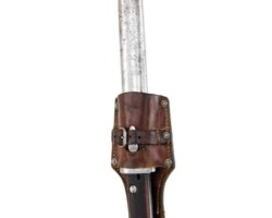 Polish bayonet, design 24
A short bayonet, produced by the Society of the Motors Factory "Perkun" in Warsaw (with a construction similar to the bayonet wz. 22). Bayonets of this type were used by the Border Guard and the Border Protection Corps.
Designation:
on the sill of the blade's front blade, the name of the manufacturer "PERKUN", serial number 106567 and a receiving stamp (obliterated by corrosion), on the threshold of the blade's rear blade, on the threshold of the blade's rear blade, the state emblem and the letters "W.P", on the handle head below the latch button (along the head) bayonet designation wz.24.
Construction:
A single-edged blade with a two-sided concave groove (wider than that of the wz. 22-13 mm bayonet, compared to 10 mm in the bayonet wz. 22). Convex double-sided cut, symmetrical single-edged tongue (in the bayonet wz. 22 - bisectors). Handle with wooden covers attached to the shaft with two bolts and nuts. The handle with a fire shield overlapping the back of the head. Mounted on the rifle in the handle guide with the barrel supported by the concave milling of the crossguard. Hole for the rod with drainage through the cuts at the bottom of the covers. Latch with spiral spring. A steel scabbard with a knob at the bottom, with a hook soldered together with a strengthening oval pad to the sheath of the scabbard. Elongated catch at the top to make it easier to remove the frog. A gland with two flat springs and a spur, attached to the sheath with a single screw.
Dimensions:
Bayonet length - 383 mm, scabbard length 402 mm, blade length - 249 mm, blade width in the fret - 25 mm, maximum blade thickness - 6 mm, handle length - 126 mm, scabbard length - 268 mm, maximum scabbard width - 32 mm.
Zbigniew Kulon's collection