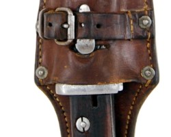 Polish bayonet, design 24
A short bayonet, produced by the Society of the Motors Factory "Perkun" in Warsaw (with a construction similar to the bayonet wz. 22). Bayonets of this type were used by the Border Guard and the Border Protection Corps.
Designation:
on the sill of the blade's front blade, the name of the manufacturer "PERKUN", serial number 106567 and a receiving stamp (obliterated by corrosion), on the threshold of the blade's rear blade, on the threshold of the blade's rear blade, the state emblem and the letters "W.P", on the handle head below the latch button (along the head) bayonet designation wz.24.
Construction:
A single-edged blade with a two-sided concave groove (wider than that of the wz. 22-13 mm bayonet, compared to 10 mm in the bayonet wz. 22). Convex double-sided cut, symmetrical single-edged tongue (in the bayonet wz. 22 - bisectors). Handle with wooden covers attached to the shaft with two bolts and nuts. The handle with a fire shield overlapping the back of the head. Mounted on the rifle in the handle guide with the barrel supported by the concave milling of the crossguard. Hole for the rod with drainage through the cuts at the bottom of the covers. Latch with spiral spring. A steel scabbard with a knob at the bottom, with a hook soldered together with a strengthening oval pad to the sheath of the scabbard. Elongated catch at the top to make it easier to remove the frog. A gland with two flat springs and a spur, attached to the sheath with a single screw.
Dimensions:
Bayonet length - 383 mm, scabbard length 402 mm, blade length - 249 mm, blade width in the fret - 25 mm, maximum blade thickness - 6 mm, handle length - 126 mm, scabbard length - 268 mm, maximum scabbard width - 32 mm.
Zbigniew Kulon's collection