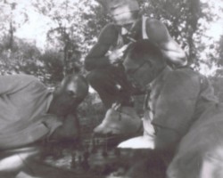 A game of chess between the delegate of the Ministry of Religious Denominations and Public Enlightenment, Michał Goławski, and his brother Stanisław (a Slovak missionary), supported by Antoni Maniak (a PE teacher), Balachadi, 1945; source: from the collection of Wiesław Stypuła A game of chess between the delegate of the Ministry of Religious Denominations and Public Enlightenment, Michał Goławski, and his brother Stanisław (a Slovak missionary), supported by Antoni Maniak (a PE teacher), Balachadi, 1945; source: from the collection of Wiesław Stypuła
