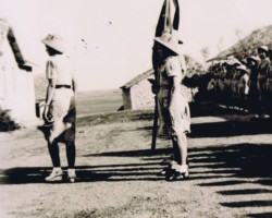 Ceremony of blessing the banner of the Jamnagar troop – scoutmaster Janina Ptak introduces the standard-bearer, Balachadi, 12 May 1945; source: from the collection of Wiesław Stypuła Ceremony of blessing the banner of the Jamnagar troop – scoutmaster Janina Ptak introduces the standard-bearer, Balachadi, 12 May 1945; source: from the collection of Wiesław Stypuła
