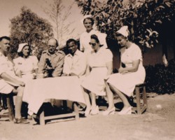 Visit of Dr. Alfred Tomanek from Bombay (first from the left) during the malaria epidemic in the estate; next to the nurse and the estate commander, Father Franciszek Pluta and Dr. Kirit Ashani (sitting in the middle), Balachadi; source: from the collection of Wiesław Stypuła Visit of Dr. Alfred Tomanek from Bombay (first from the left) during the malaria epidemic in the estate; next to the nurse and the estate commander, Father Franciszek Pluta and Dr. Kirit Ashani (sitting in the middle), Balachadi; source: from the collection of Wiesław Stypuła