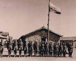 The first Scout troop in India named after Tadeusz Kościuszko on the parade ground, visible is the troop leader Henryk Bobotek, Balachadi, 1942; source: from the collection of Wiesław Stypuła The first Scout troop in India named after Tadeusz Kościuszko on the parade ground, visible is the troop leader Henryk Bobotek, Balachadi, 1942; source: from the collection of Wiesław Stypuła