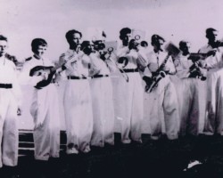 Part of the orchestra in formal costumes during a performance, Balachadi; source: from the collection of Wiesław Stypuła Part of the orchestra in formal costumes during a performance, Balachadi; source: from the collection of Wiesław Stypuła