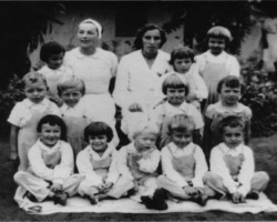 Janina Dobrostańska (sitting on the right) with the youngest children from the Balachadi settlement, 1943; source: Poles from India Association Janina Dobrostańska (sitting on the right) with the youngest children from the Balachadi settlement, 1943; source: Poles from India Association