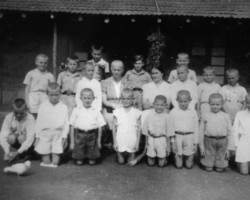 The head of the General W. Sikorski Educational Facility - Olga Sasadeusz (sitting on the left) with one of the caregivers and the orphanage's charges; source: Koło Polaków z Niechciał z Niechciał The head of the General W. Sikorski Educational Facility - Olga Sasadeusz (sitting on the left) with one of the caregivers and the orphanage's charges; source: Koło Polaków z Niechciał z Niechciał