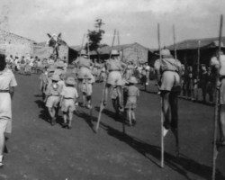 Young scouts on stilts marching along the street of the housing estate in Valivade; source: Poles from India Association Young scouts on stilts marching along the street of the housing estate in Valivade; source: Poles from India Association